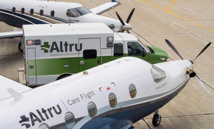 Two Altru care flight planes and an Altru ambulance.